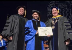 Charlie receiving honorary Ph.D. degree