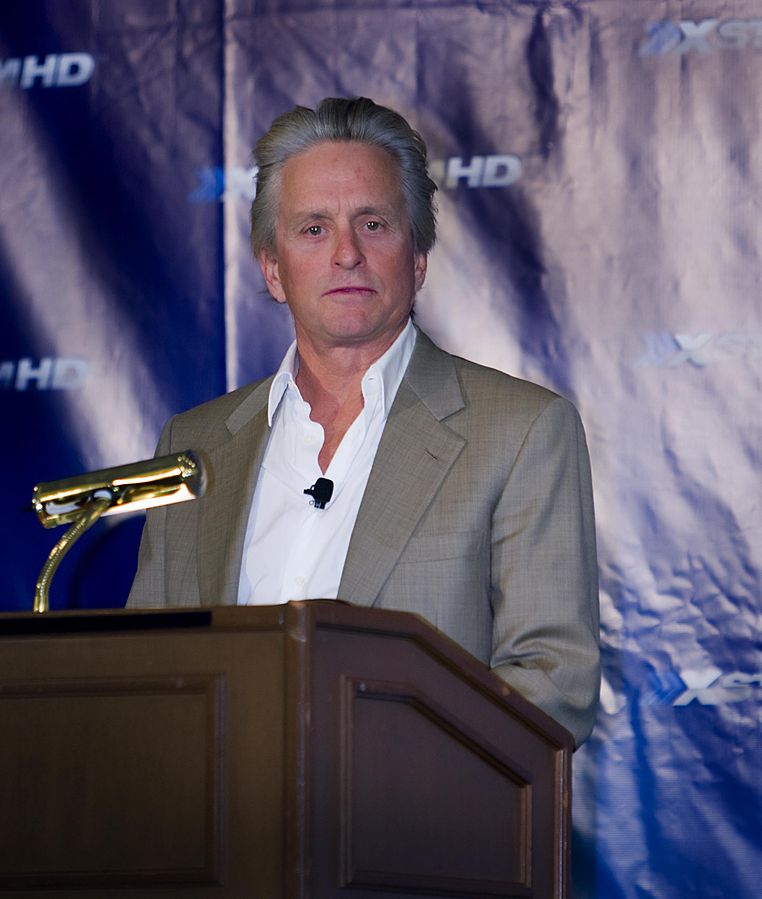 Michael Douglas speaking on a conference meeting.