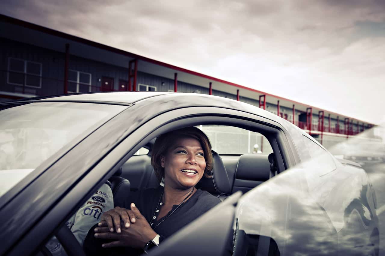 Queen Latifah, photographed inside her car, Ford Mustang 2010.