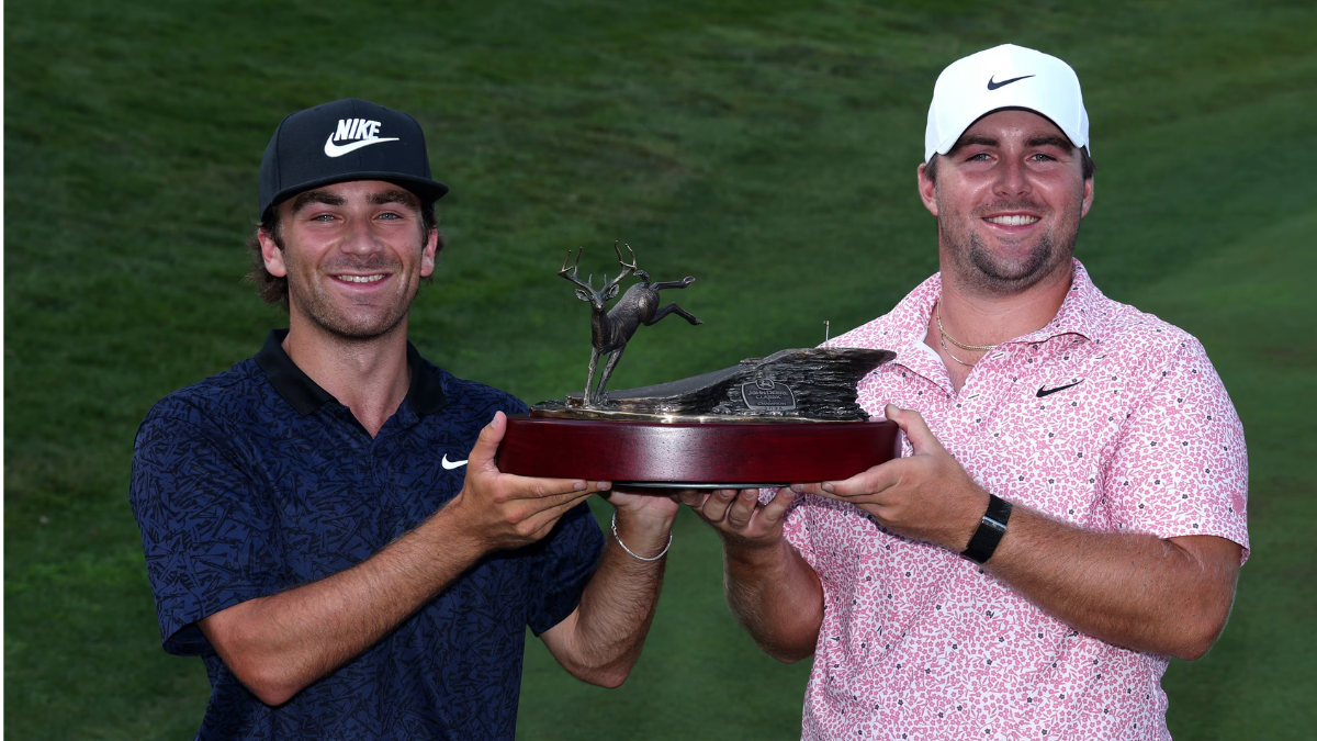 Chris Gotterup celebrates with his brother and caddie Patrick Gotterup after winning the 2026 John Deere Classic