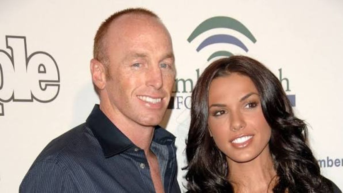 A smiling man and woman posing together at an event