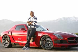 Anderson Silva posing with his Mercedes. 