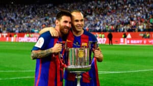 Iniesta in his Barcelona club with teammate Lionel Messi 