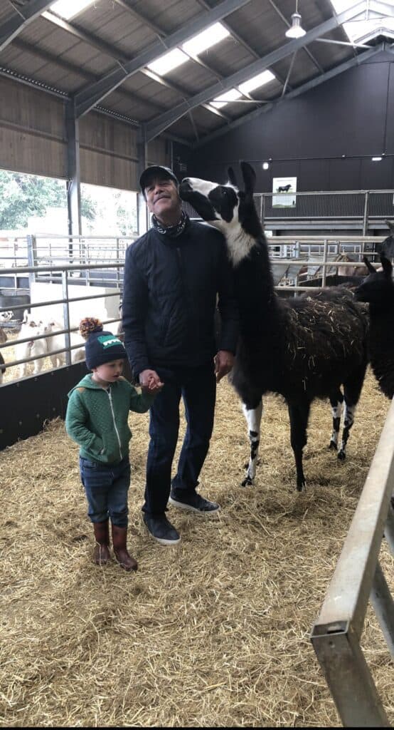 Chris and his grandson visiting a farm. Source: Chris's Twitter