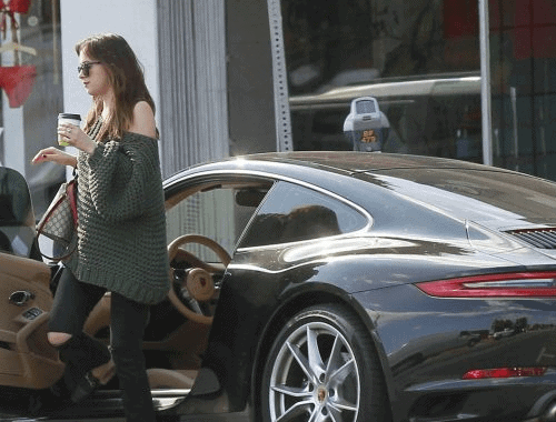 Dakota with her black Porsche