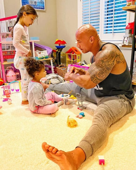 Dwayne playing with his daughters