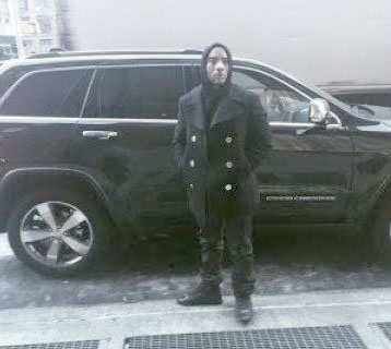 charlamagne-tha-god-posing-infront-of-his-car