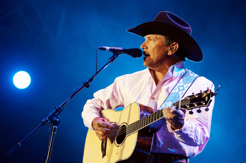 George Strait performing on the stage.