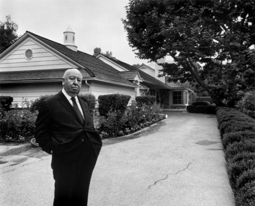 Hitchcok standing innfront of his house in Bel Air, Los Angeles