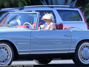 Perry riding her Vintage Mercedes Poton