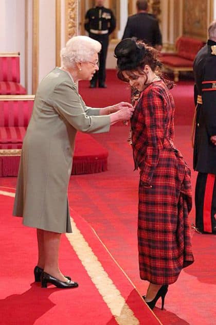 Helena Bonham Carter receiving a honorary title of CBE from Queen Elizabeth