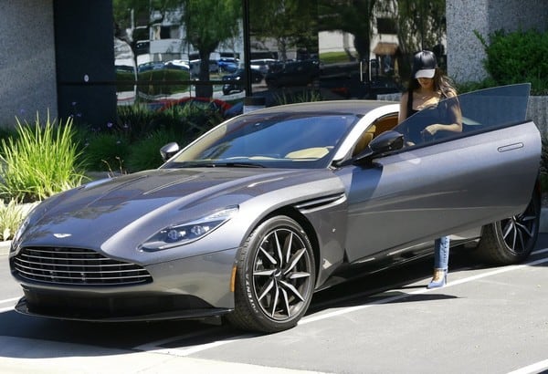 Kourtney Kardashian photographed while getting insde her car, The Aston Martin DB11.