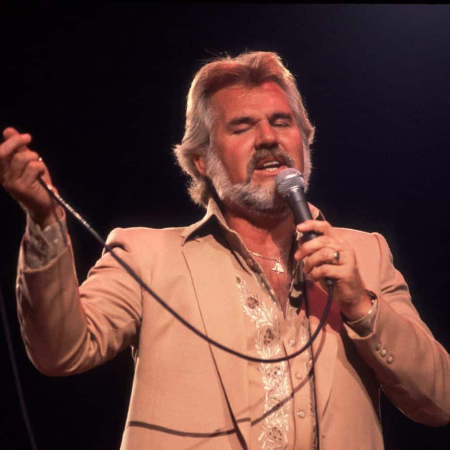 Kenny Rogers performing live on the stage.
