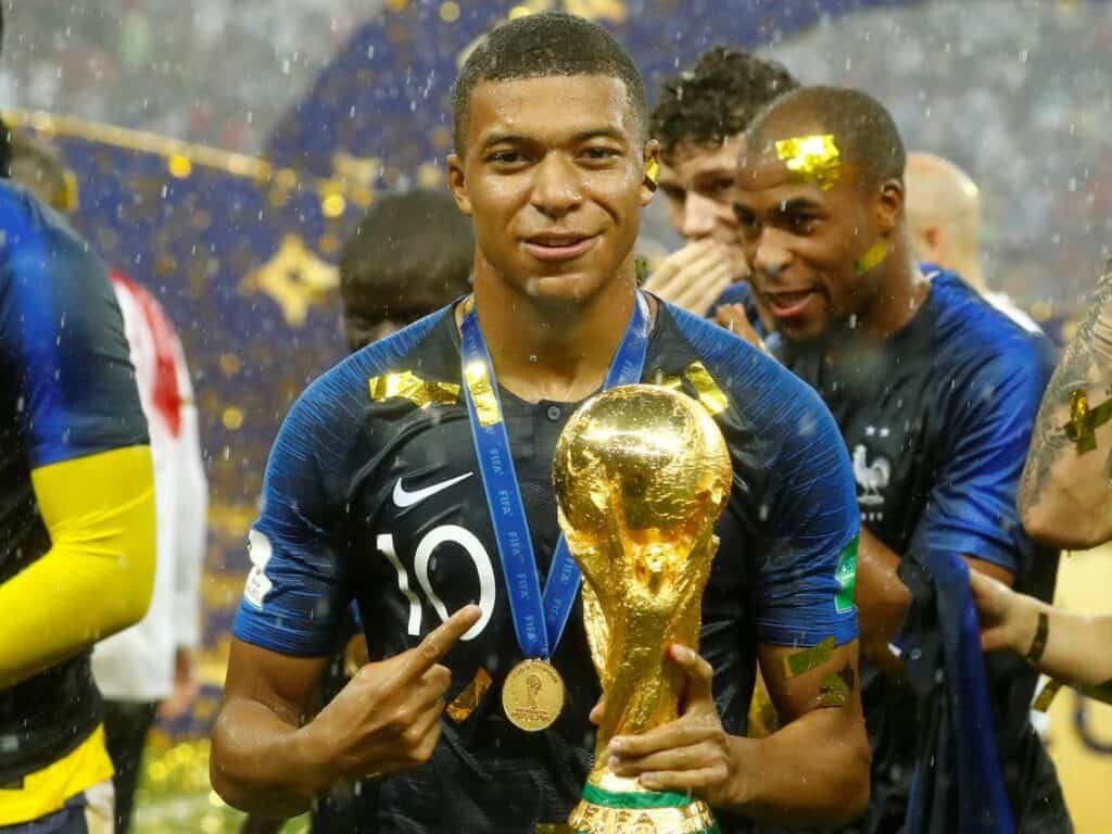 Kylian Mbappe with World Cup trophy 