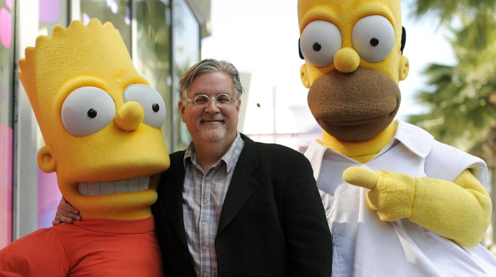 Matt Groening photographed with casting white actors of longest-running primetime television show "The Simpsons".