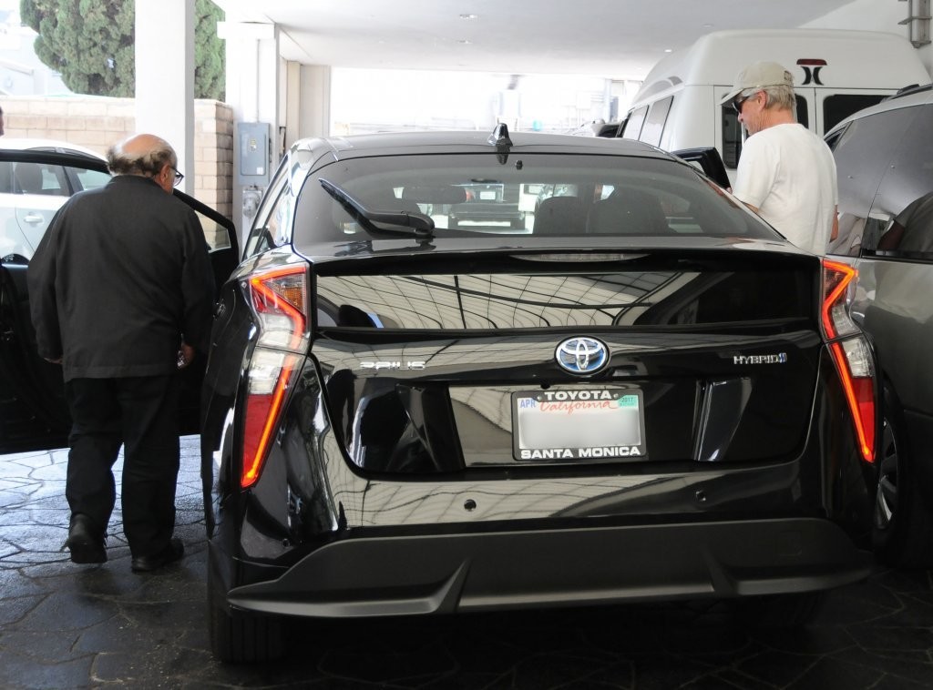 Michael Douglas, captured getting inside his Toyota Prius.