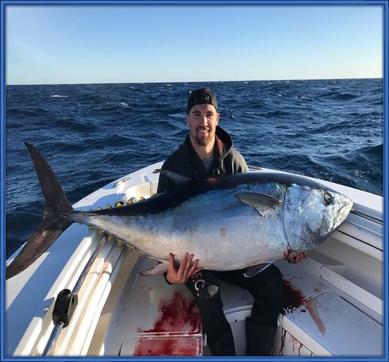 Matt Ryan posing with a giant fish.