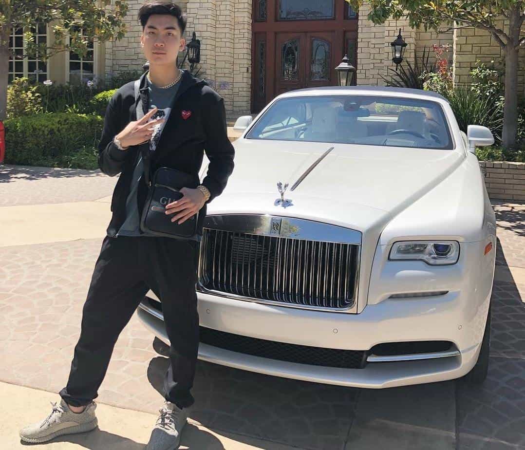 RiceGum posing with his Rolls Royce