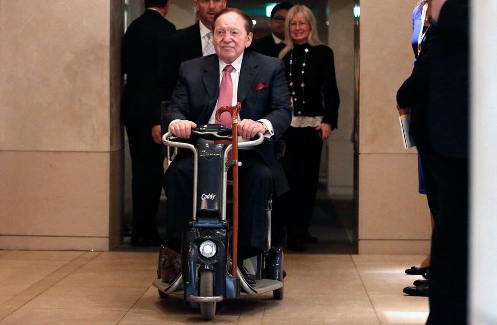 Sheldon Adelson on a Automatic Wheel Chair