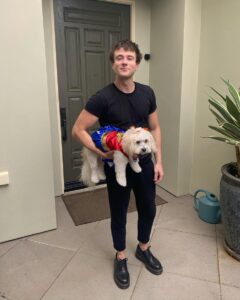 Alec and his pet dressed as Wonder Woman for Halloween