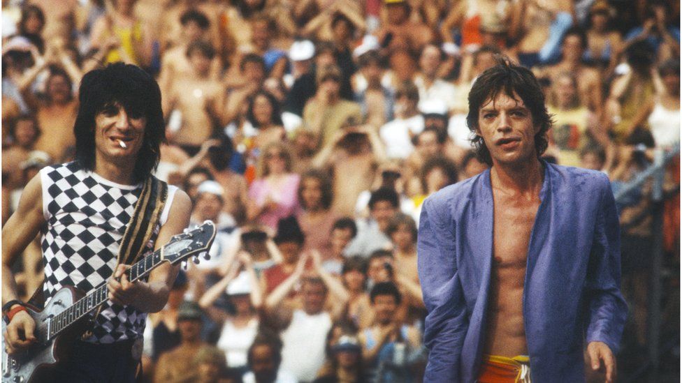 Ronnie and Mick Jagger at a Concert