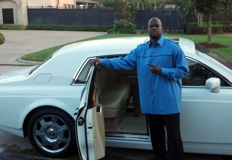 Vince Young Net Worth- Vince With His Car (Source; KUT.org)
