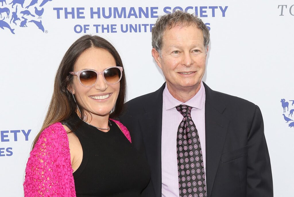 John With His Wife (Source: CNBC)