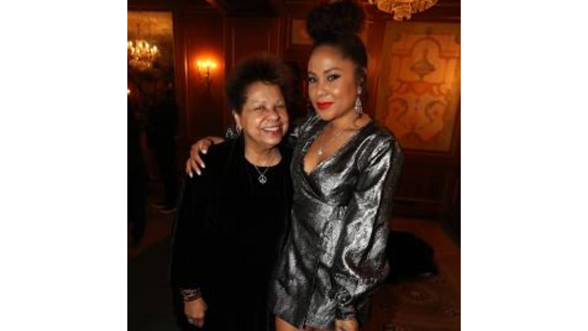 Angela Yee posing with her mother at an elegant evening event